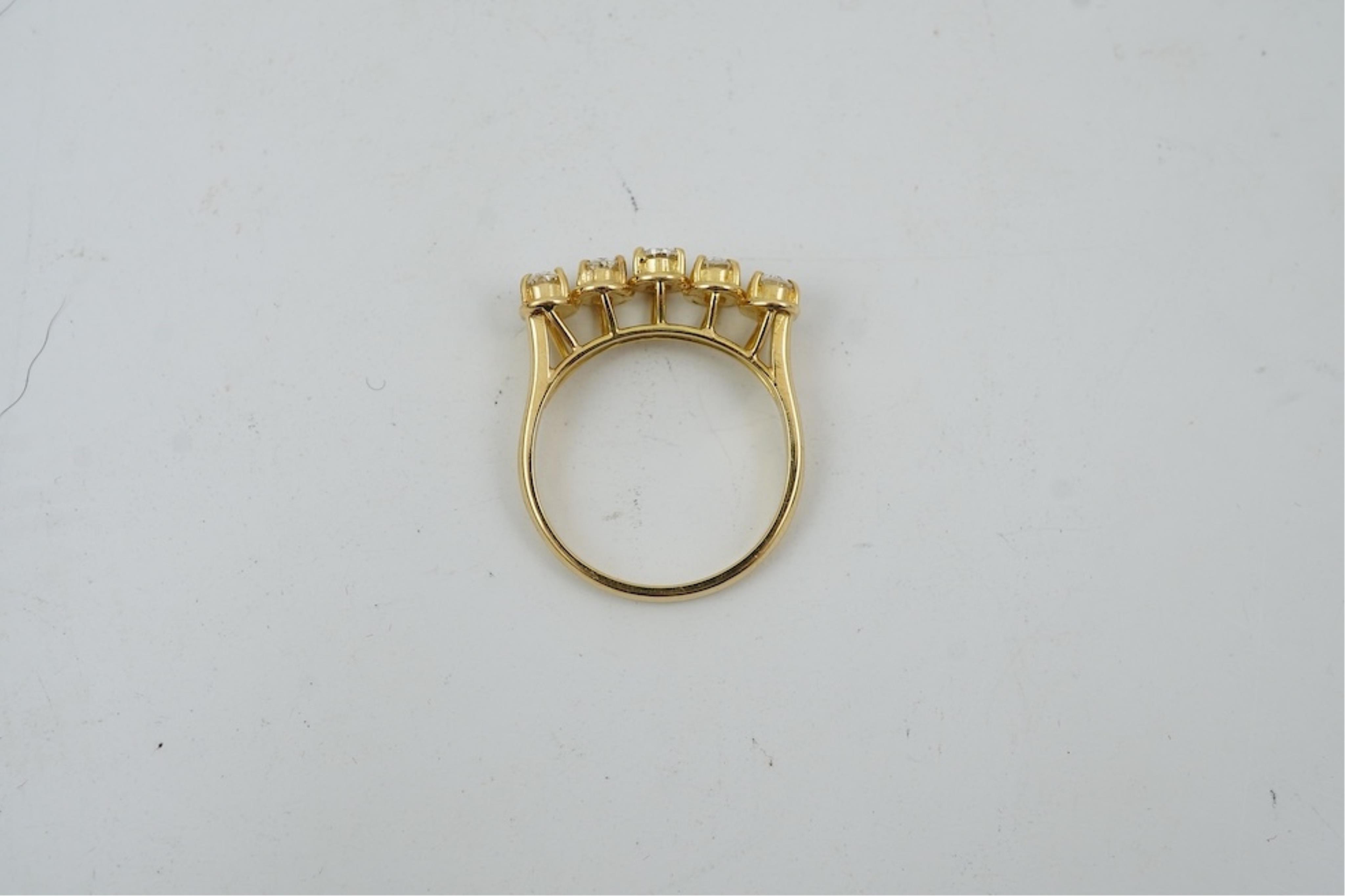 A modern 18ct gold and five stone oval cut diamond set half hoop ring, size N, gross weight 3.8 grams.